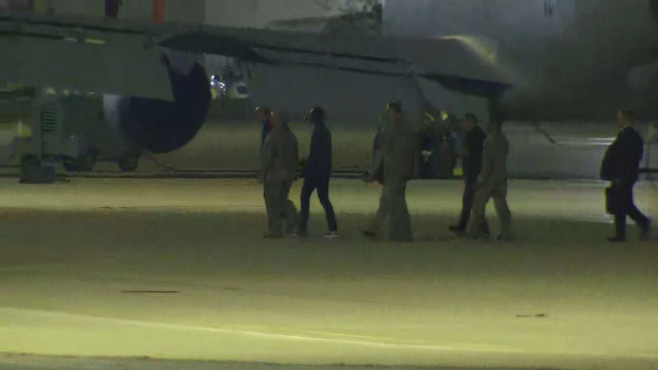 A screengrab from a video shows an individual who appears to be Travis King, third from right, deplaning after landing at Kelly Field near San Antonio on September 28, 2023.